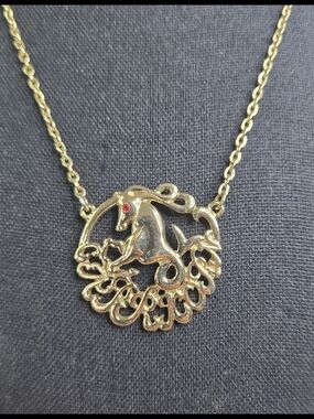 Gold Tone Zodiac CapricornPendant Necklace with Red Eye Accent